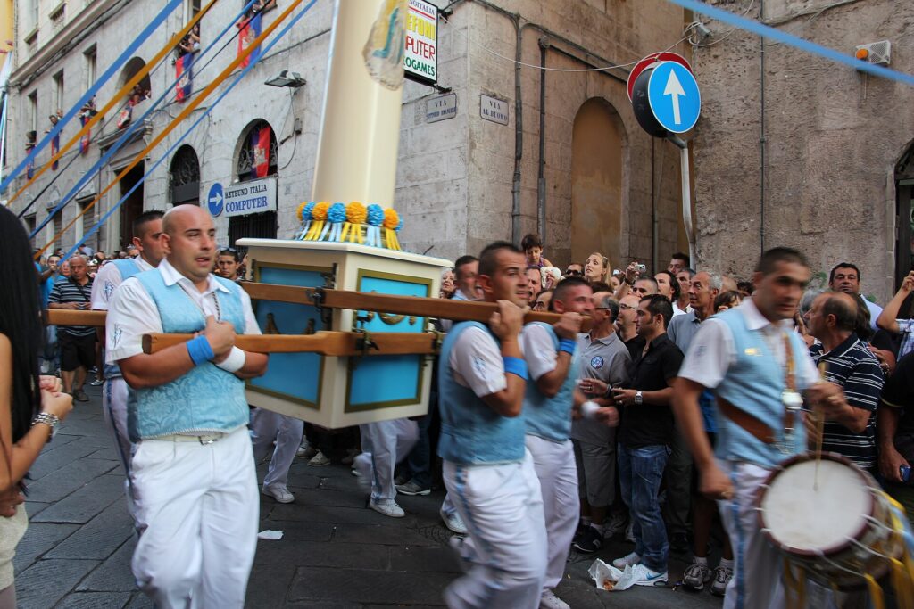 Guild bearers carry the candeliere on their shoulders during the Faradda in Sassari